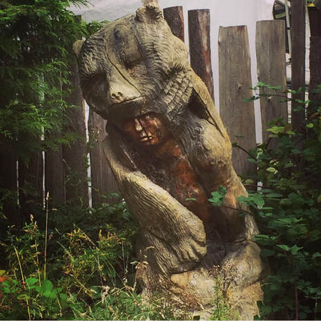 spirit bear wooden statue by Chrystos...