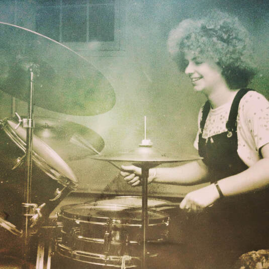 young weaver at her beloved drums